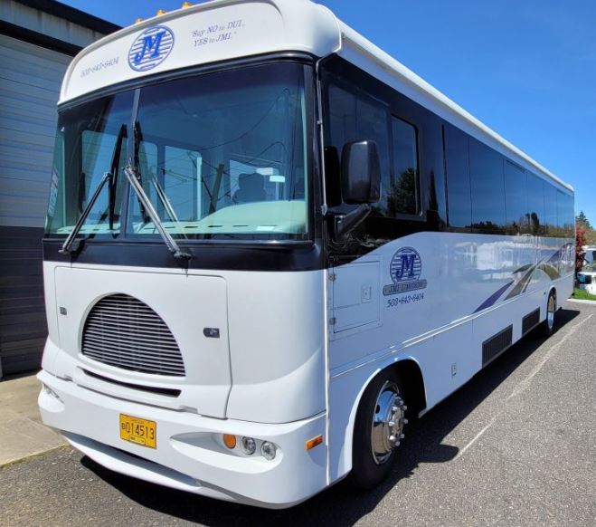 Charter Bus Portland Oregon - White Charter Bus JMI Limousine